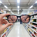 A bright store aisle seen through the rose lens